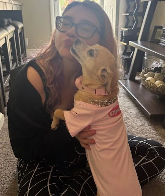 Brianna getting puppy kisses